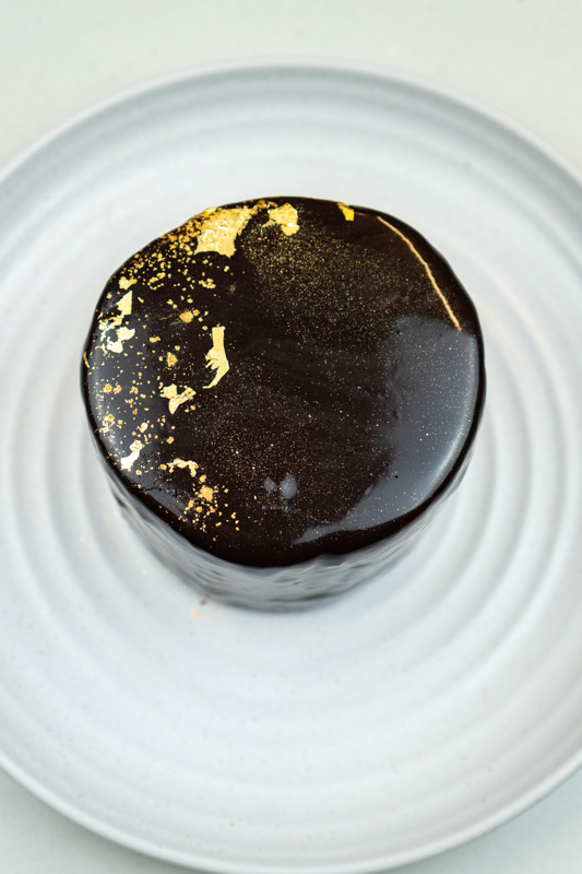 Chocolate Mirror Glaze on a Cake