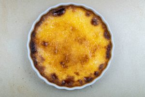 Removing the creme brulee from the oven