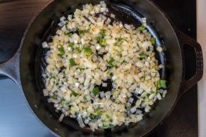 Cooking the onion, jalapeños and cilantro