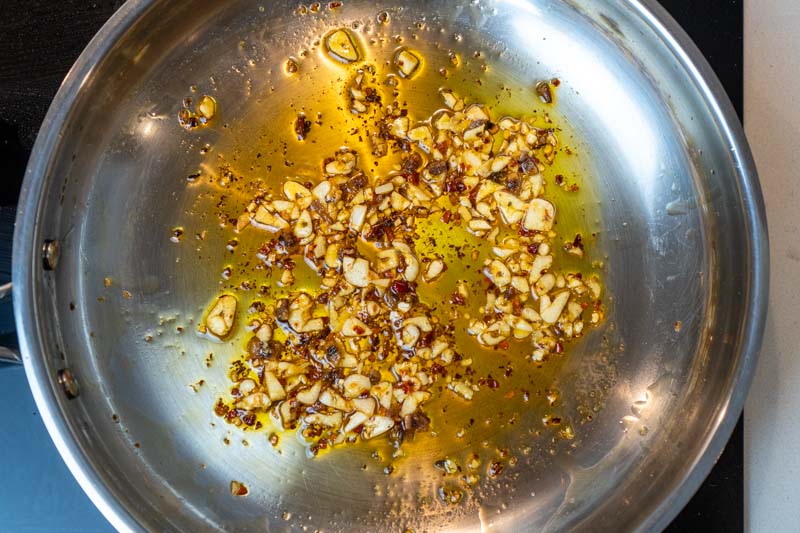Cooking the garlic, chili & anchovy