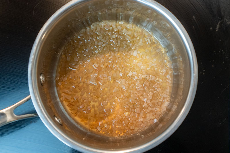 Reducing the wine, vinegar and shallot