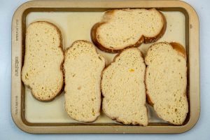 Pouring the custard over the bread