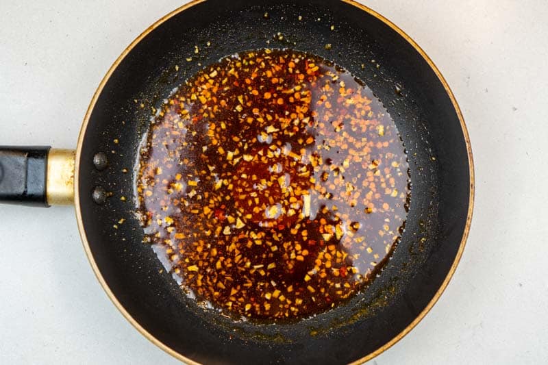 Cooking the garlic, paprika and chili flakes