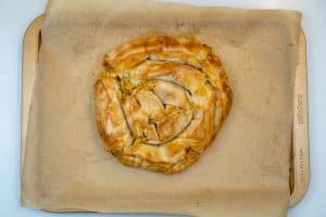 Removing the burek from the oven