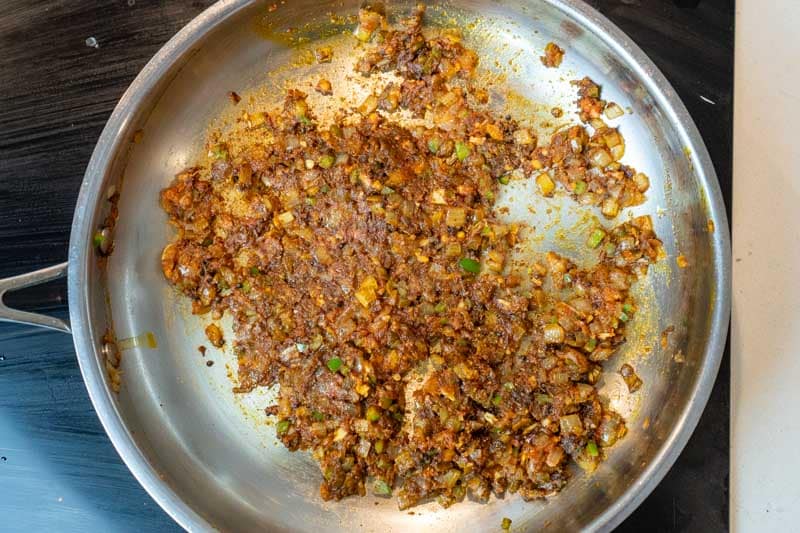 Adding tomato paste & spices
