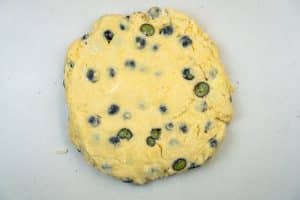 Patting the dough into a disc