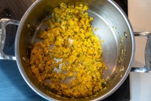 Stiring in the garlic, lemon zest and oregano