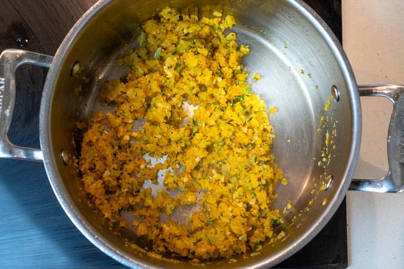 Stirring in the garlic, lemon zest and oregano