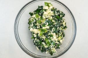 Mixing the cheese & greens