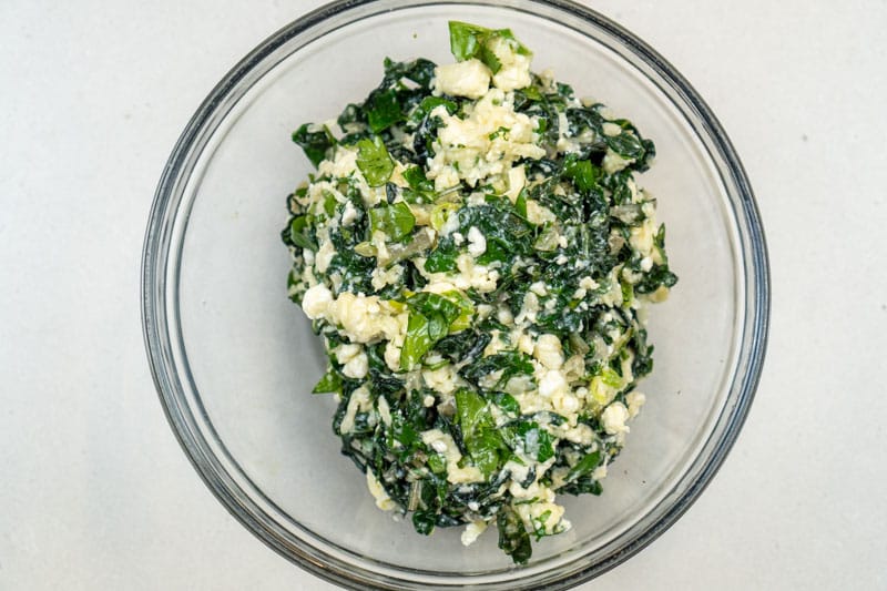 Mixing the cheese & greens