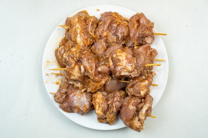 Placing the chicken on skewers