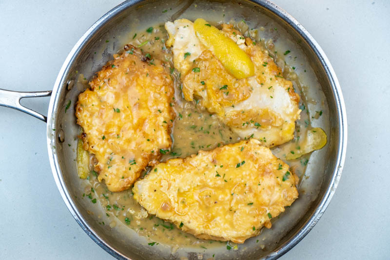 Adding the chicken back to the pan