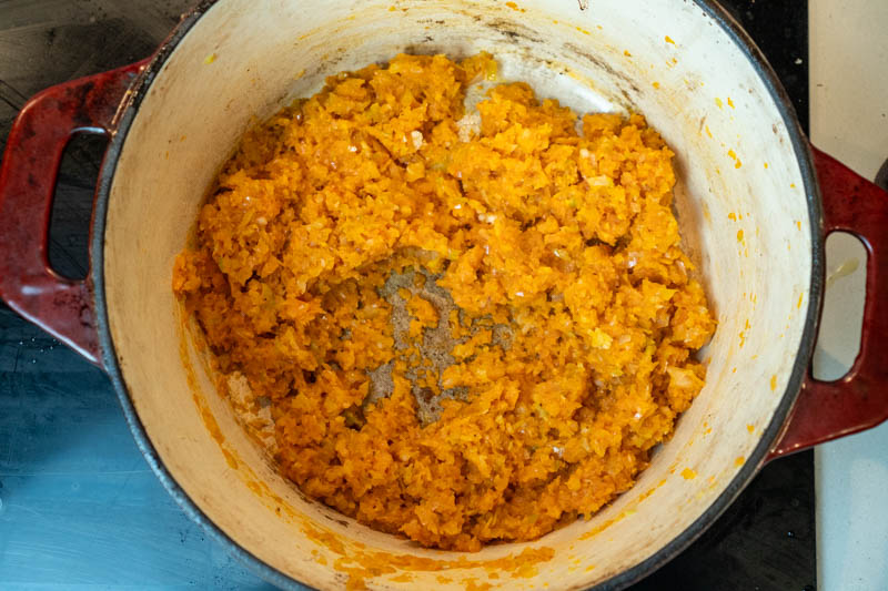 Stirring in the garlic & tomato paste