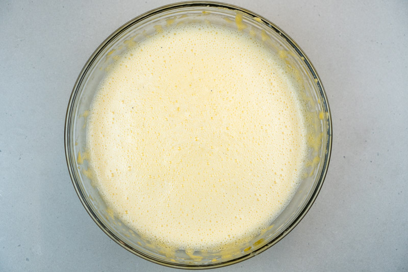 Adding the milk into the egg mixture