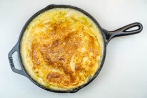 Removing the pot pie from the oven