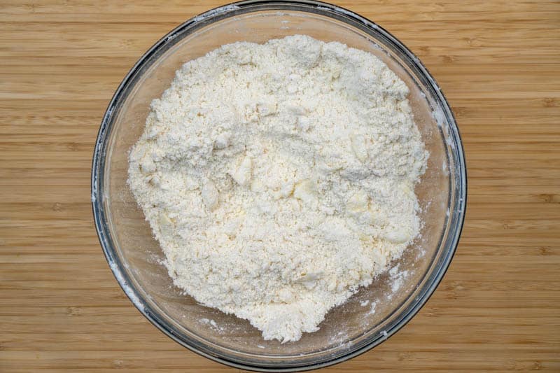 Adding the butter to the flour