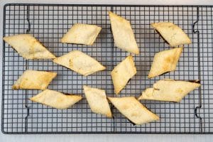 Removing the biscuits from the oven