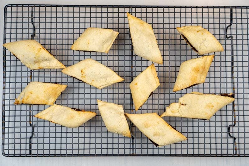Removing the biscuits from the oven