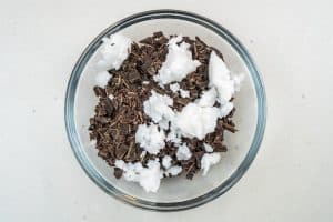 Adding the chocolate & coconut oil to a bowl